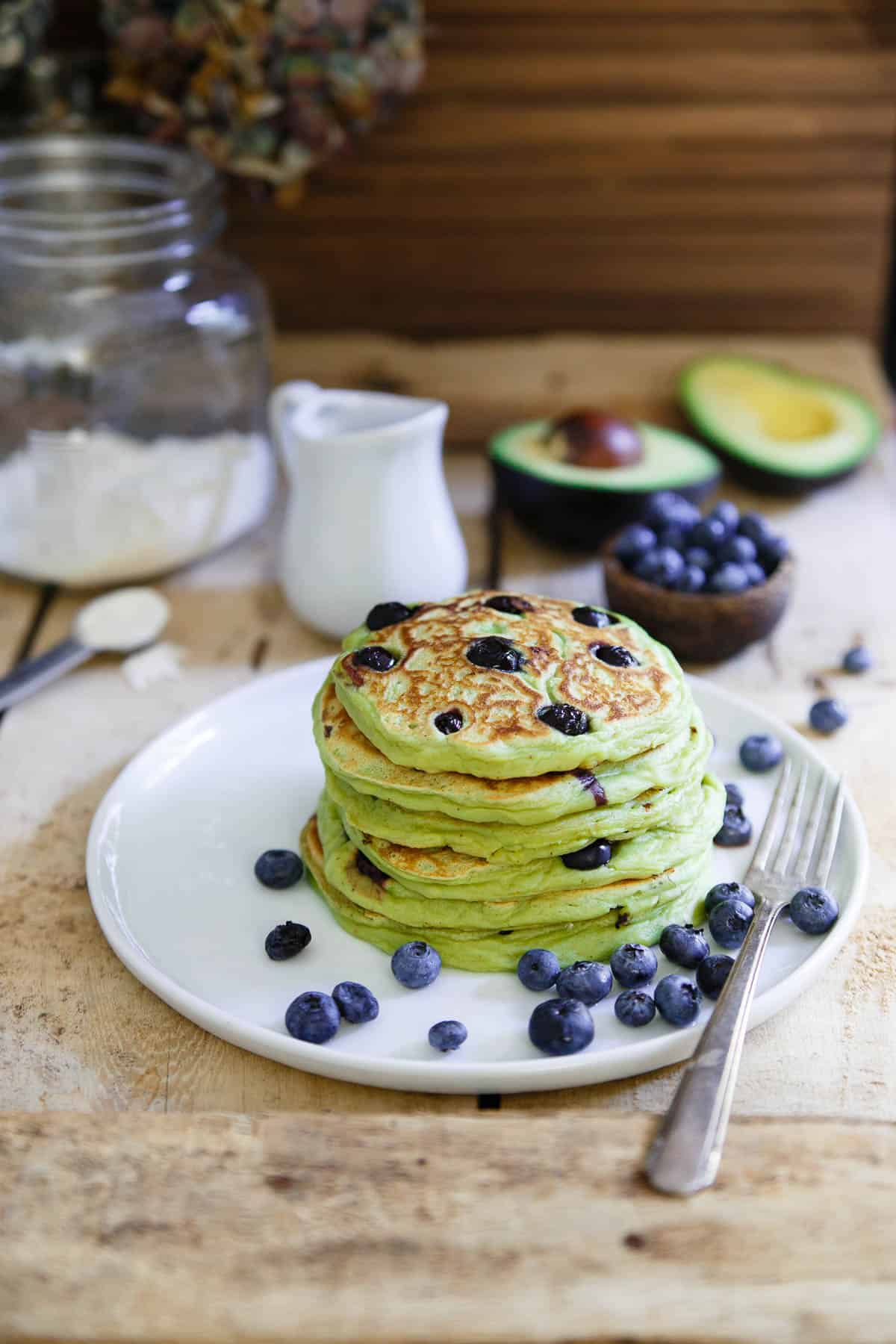 These avocado pancakes are packed with fresh blueberries, fluffy, thick and when topped with a poached egg, the perfect combination of savory and sweet.